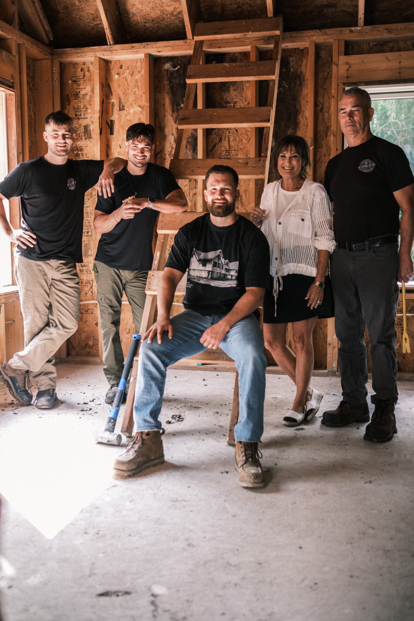 The Harr family on a job site mid-renovation